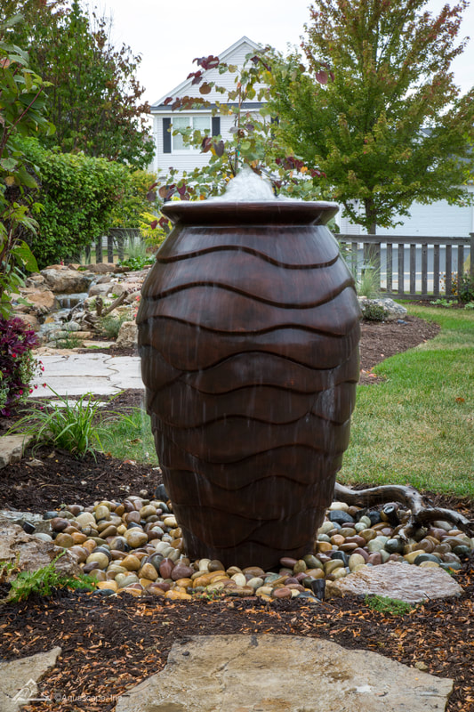 Neighborhood Lawn care in Vancouver, WA, Battle Ground, WA.  Water Feature with urn bubbler.