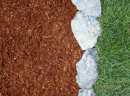 Neighborhood Lawn Care in Vancouver, WA.   Bright hemlock bark dust with rock border